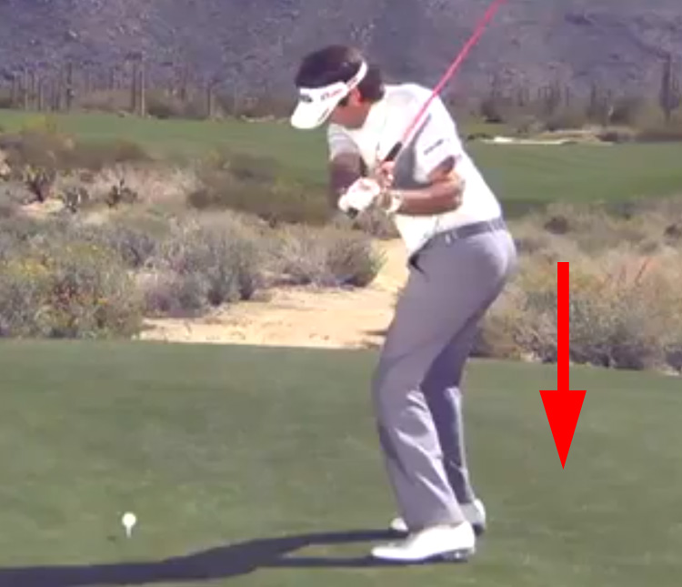 Bubba Watson compresses down during is downswing.