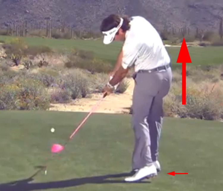 Bubba Watson jumping out of his squat during impact.